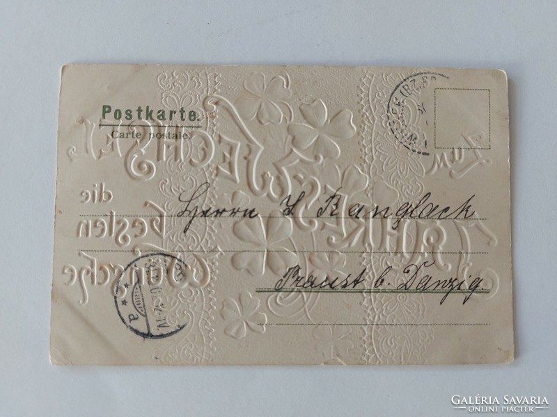 Old embossed postcard with clover lace