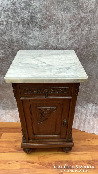 Antique carved oak chest of drawers with marble top
