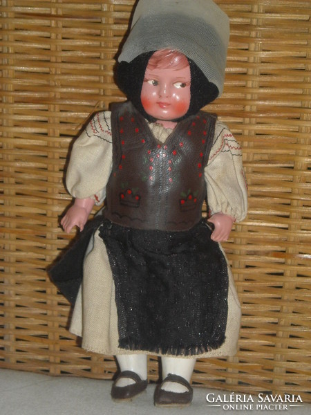 Antique doll in folk costume
