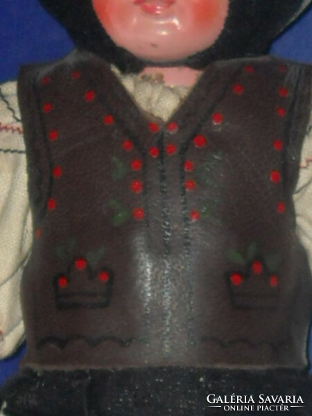 Antique doll in folk costume