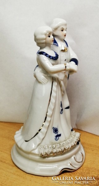 Dancing couple. Porcelain nip. Baroque style with blue painting