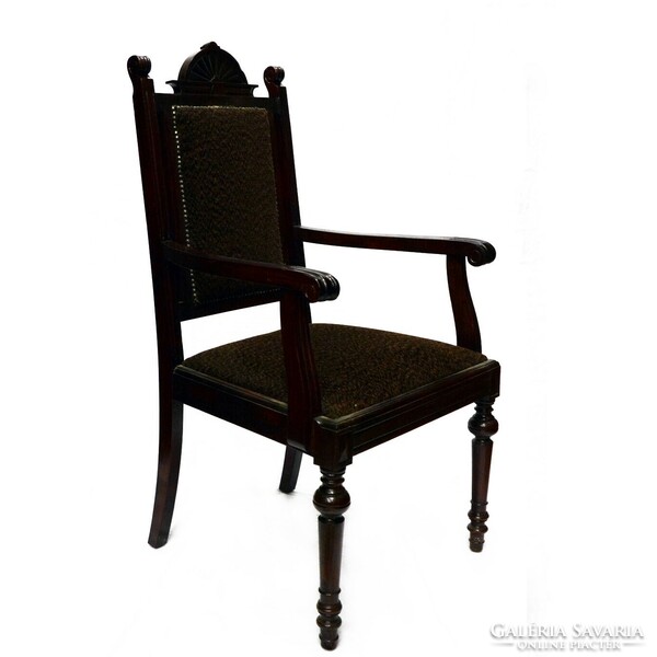 A pewter carved armchair