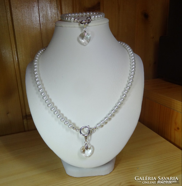 Necklaces made of beautiful glass pearls with white mother-of-pearl shine are now fashionable with swarovski crystal pendants.