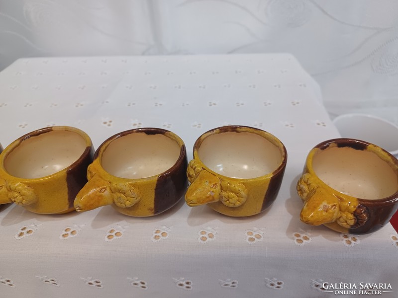 Ceramic cups with ram's head