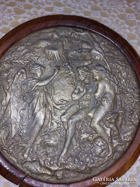 Metal mythological, scenic wall picture, which is placed on a wooden support