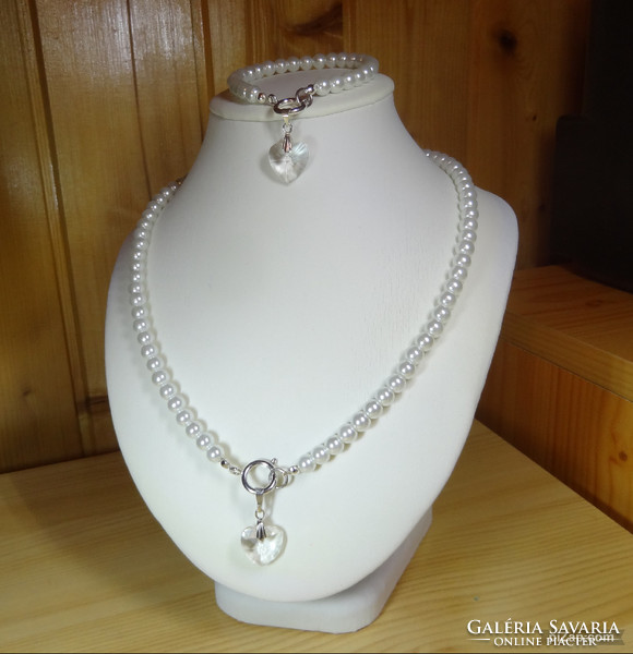 Necklaces made of beautiful glass pearls with white mother-of-pearl shine are now fashionable with swarovski crystal pendants.