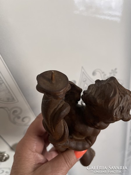 Baroque beautiful, meticulously carved putto candle holder.
