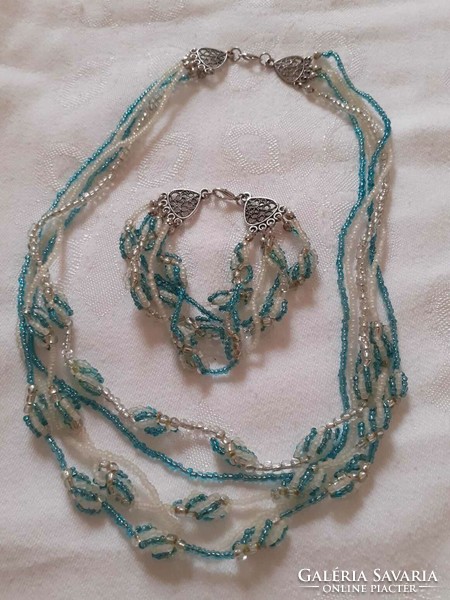 A necklace and bracelet made of showy small glass beads