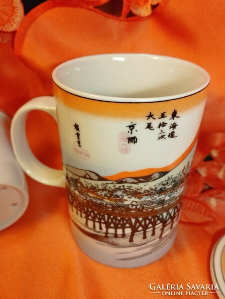 Chinese tea cup with strainer and lid