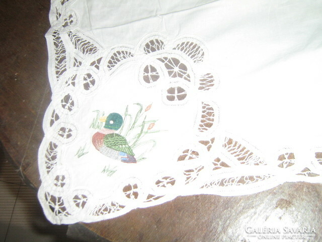 Beautiful white lace tablecloth with a special wild duck embroidered ribbon