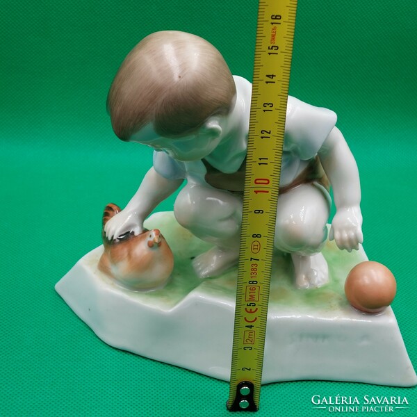 András Zsolnay Sinkó porcelain figure of a child with a hen