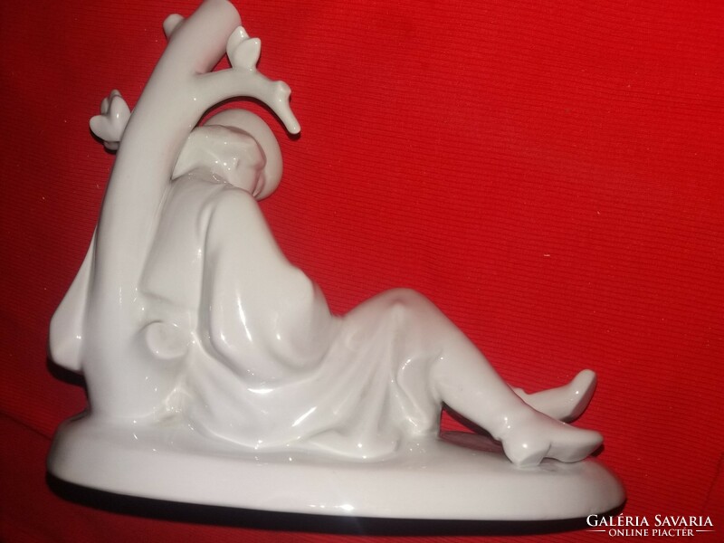 Antique rare Zsolnay porcelain figurine of a shepherd playing the flute lying down, white 22 x 23 cm as shown in the pictures