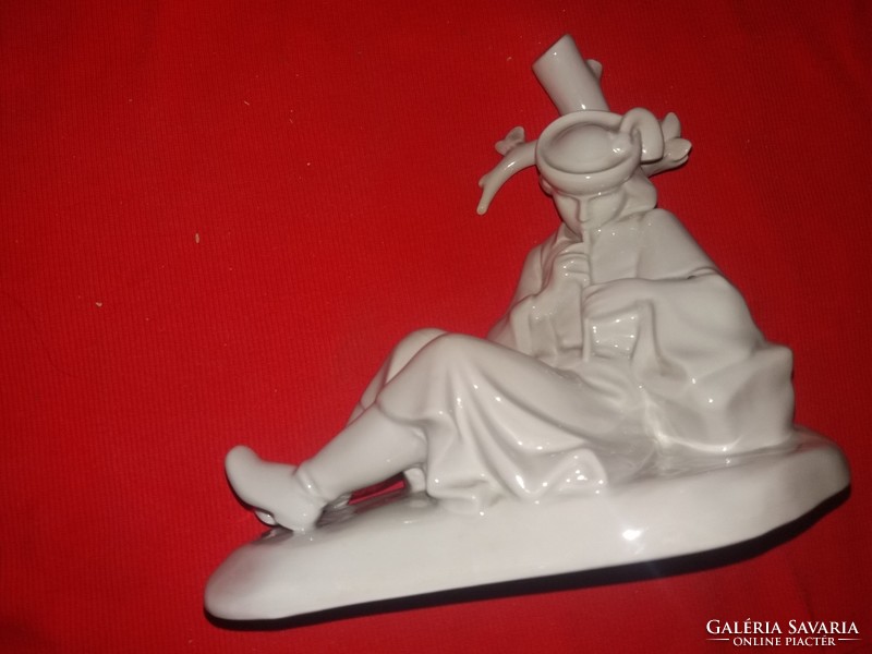 Antique rare Zsolnay porcelain figurine of a shepherd playing the flute lying down, white 22 x 23 cm as shown in the pictures