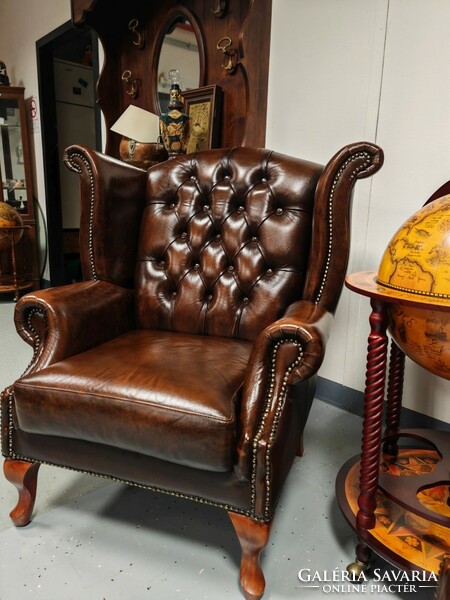 A pair of original English Chesterfield wingback armchairs, in beautiful, patina condition