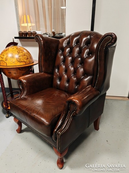 A pair of original English Chesterfield wingback armchairs, in beautiful, patina condition