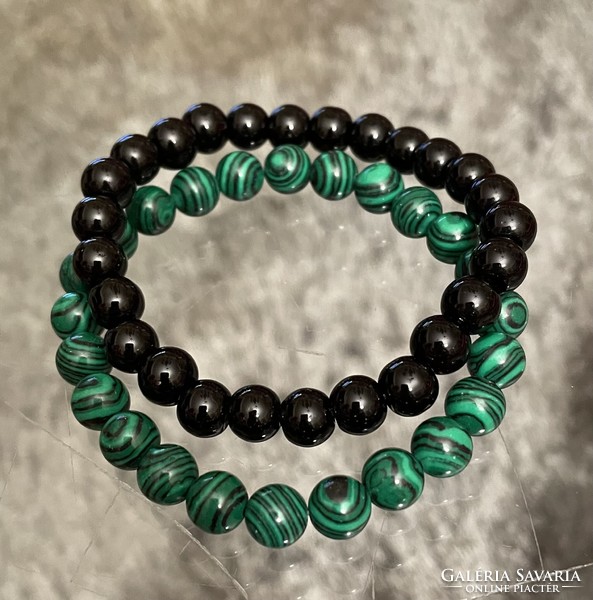 Green malachite and black onyx mineral friendship bracelets in a pair