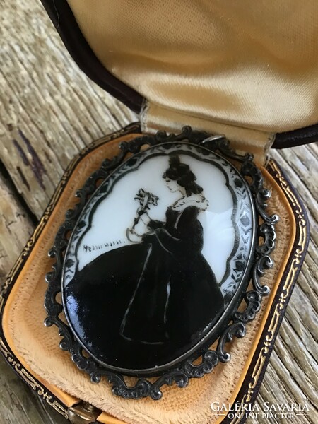 Antique hand-painted porcelain pendant-brooch in a silver frame.