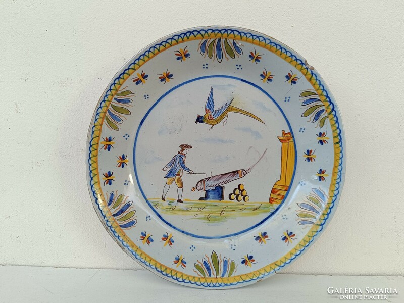 Antique Delft porcelain plate with painted cannon military cardboard motif hairline crack 19th century 8643