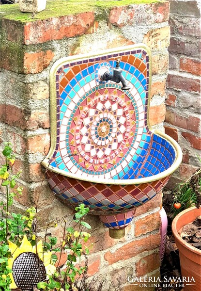Wall well, fountain, hand basin decorated with mosaics