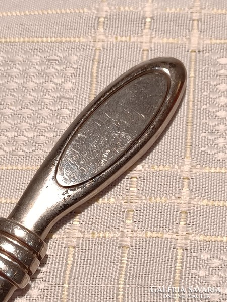 An old silver-plated leaf opener in a beautiful shape