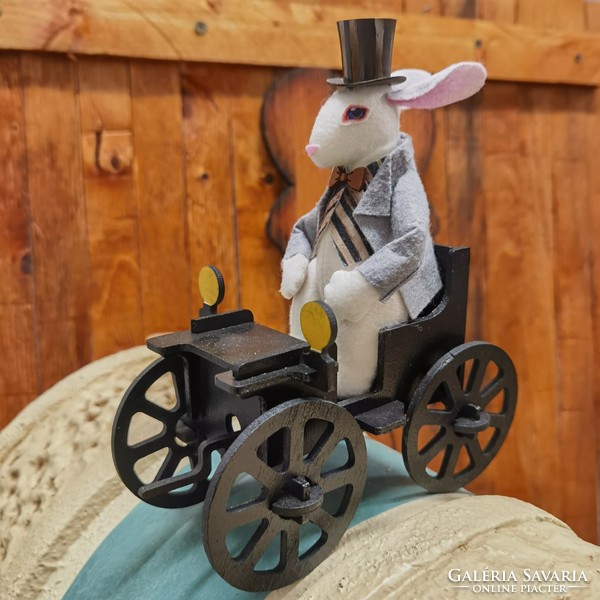 Victorian rabbit figure with a vintage car