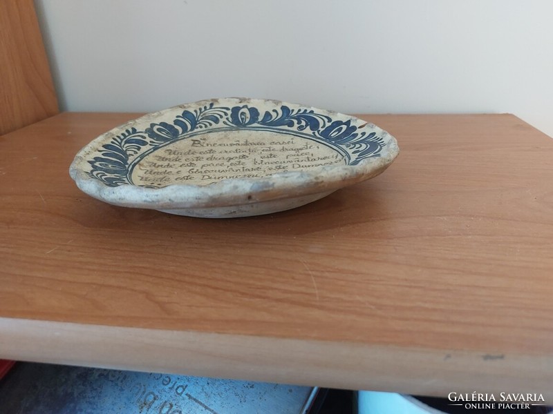 Old wall plate with a homemade blessing in Romanian