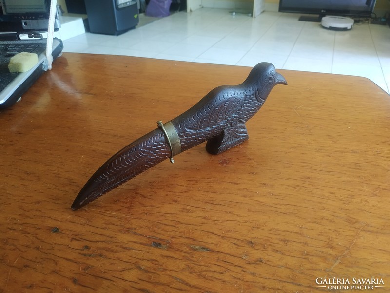 Retro carved bird figurine with knife
