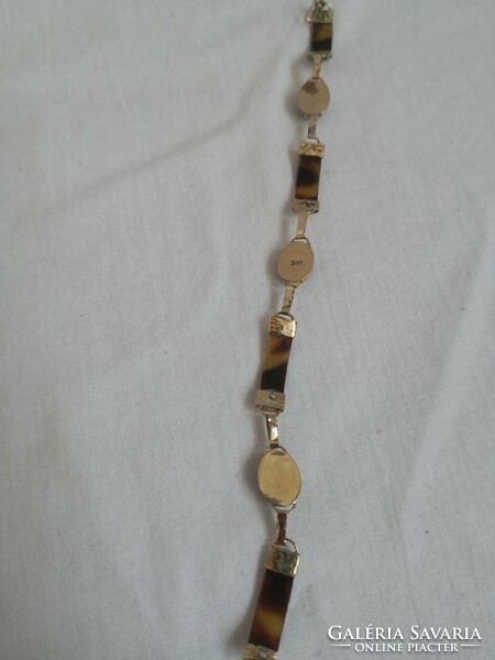14K gold bracelet with tortoise shell inlay.