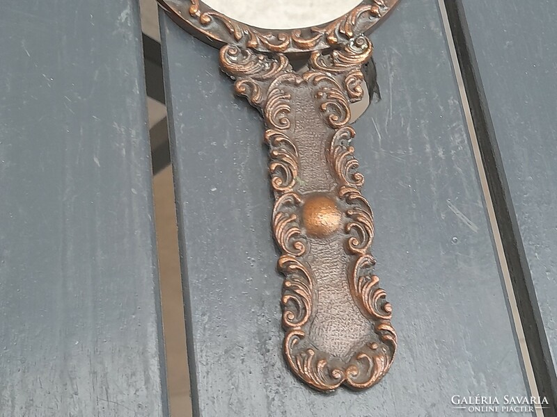 Beautiful bronzed metal hand mirror with flawless mirror