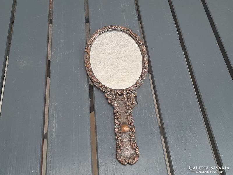 Beautiful bronzed metal hand mirror with flawless mirror