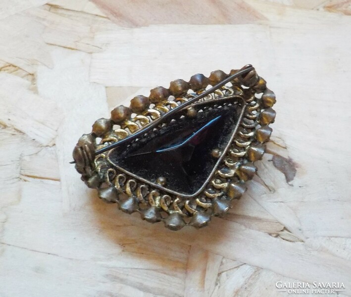 Old brooch with black and white stones