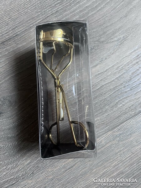 Eyelash curler, in unopened packaging, gold color
