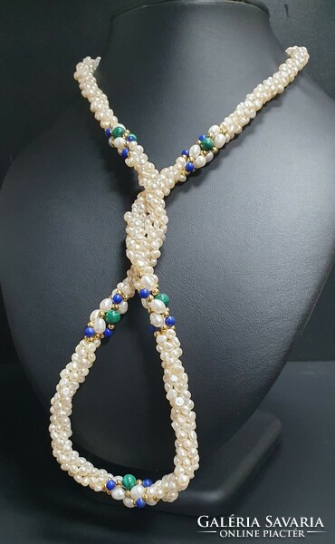 Remarkable baroque 4-row string of pearls with malachite and lapis lazuli decoration. With certification.
