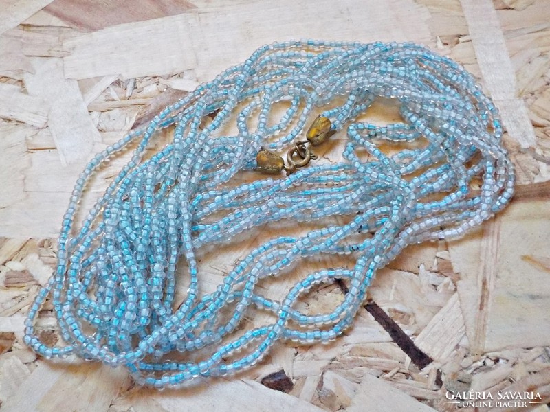 Long multi-row necklace with tiny blue glass beads