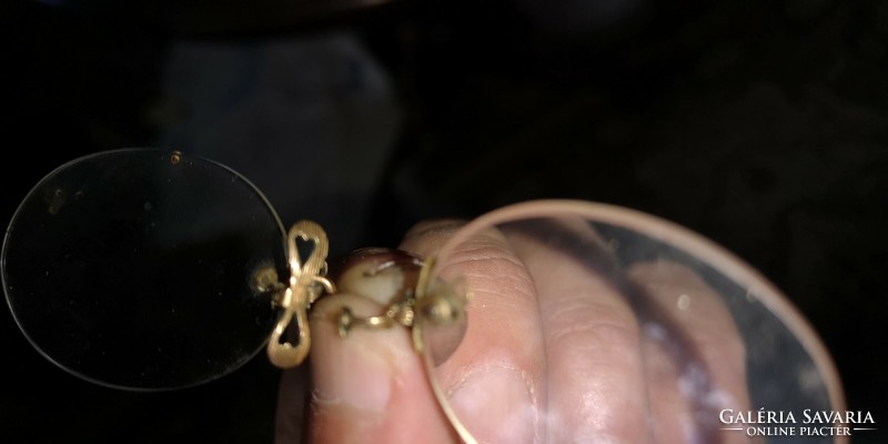 Antique glasses with gold nose part