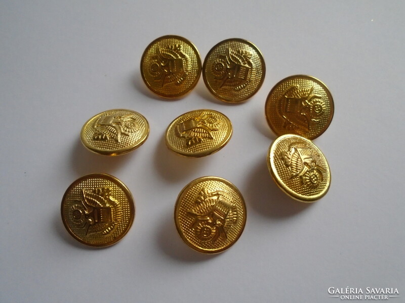 8 Pcs. New gold colored metal buttons.