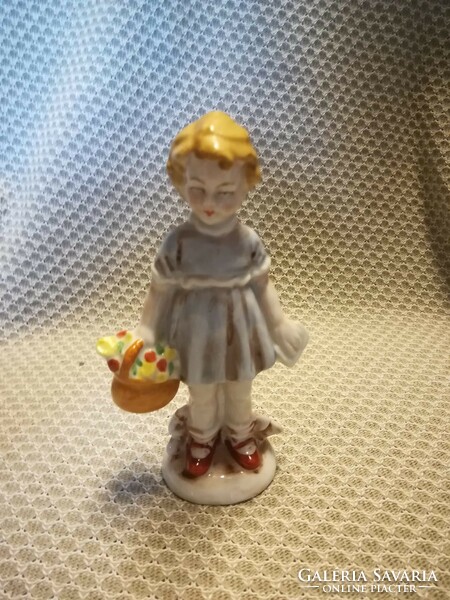 Porcelain girl with a flower basket
