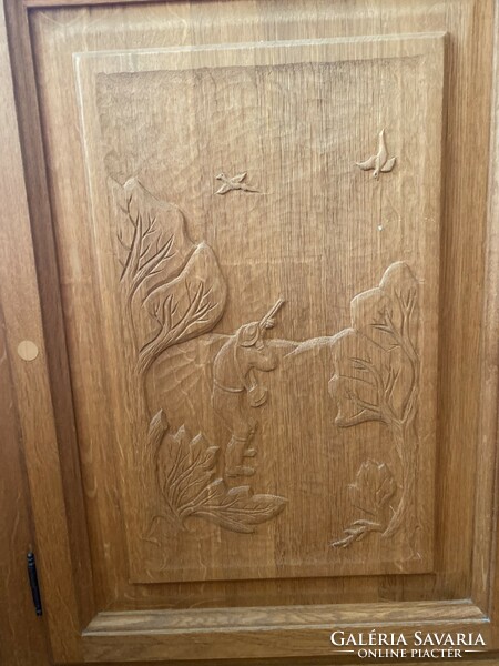 Carved oak corner cabinet/chest with hunting motifs