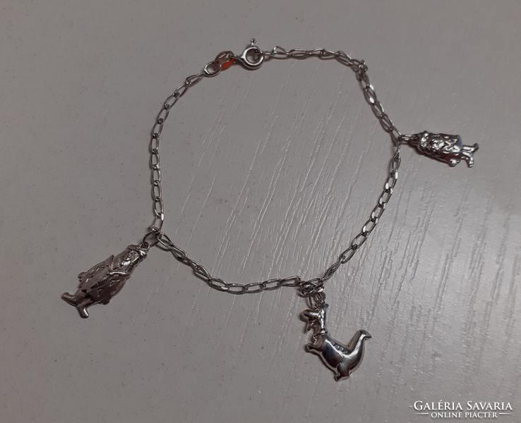 Marked 925 silver women's bracelet with elaborate Fred's lame dino pendants