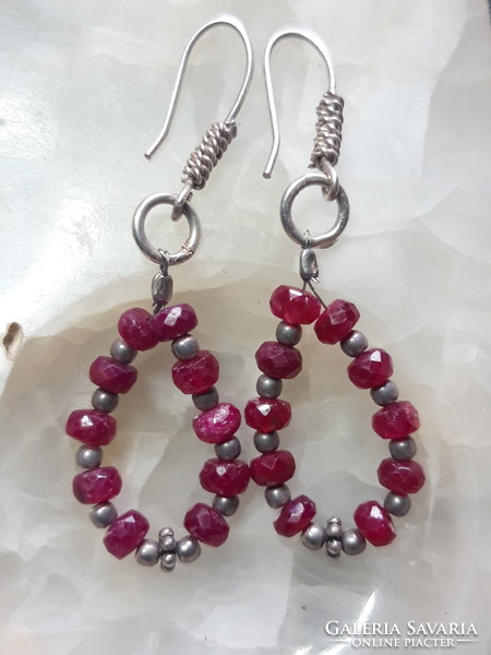 Silver earrings with faceted ruby pearls