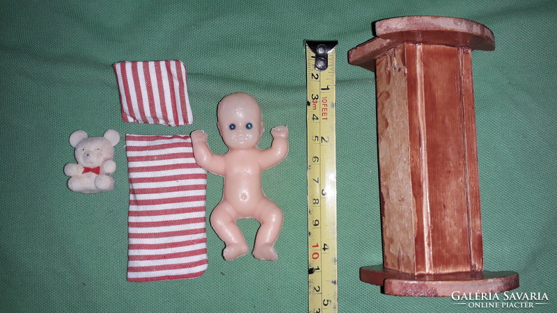Antique 8 cm dmsz small toy doll in a 10 cm wooden cradle with a teddy bear and bedding as shown in the pictures