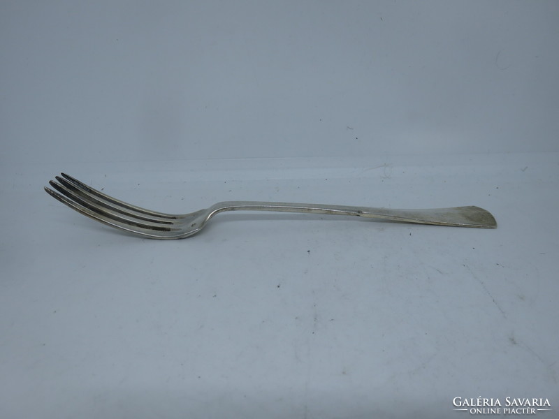 Silver fork with diana head hallmark.