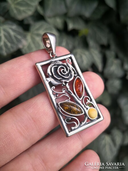 Beautiful, rosy silver pendant with amber stones