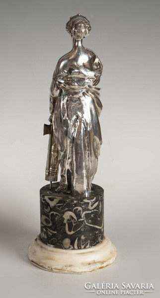Silver statue of the goddess Artemis on a marble plinth