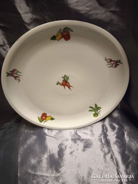 Retro lowland porcelain round serving plate with a pattern of vegetables.