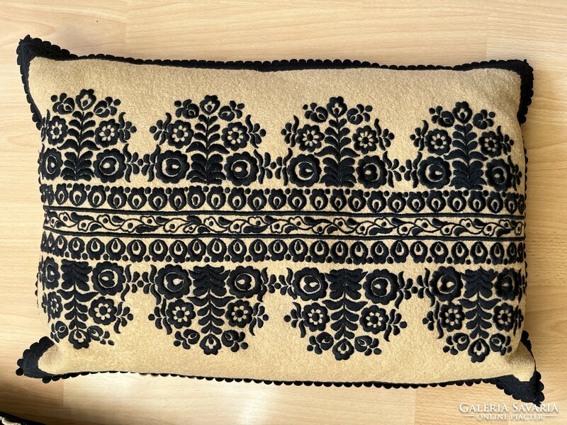 Black and brown embroidered decorative pillow