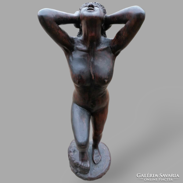 Signed female nude statue made of wood