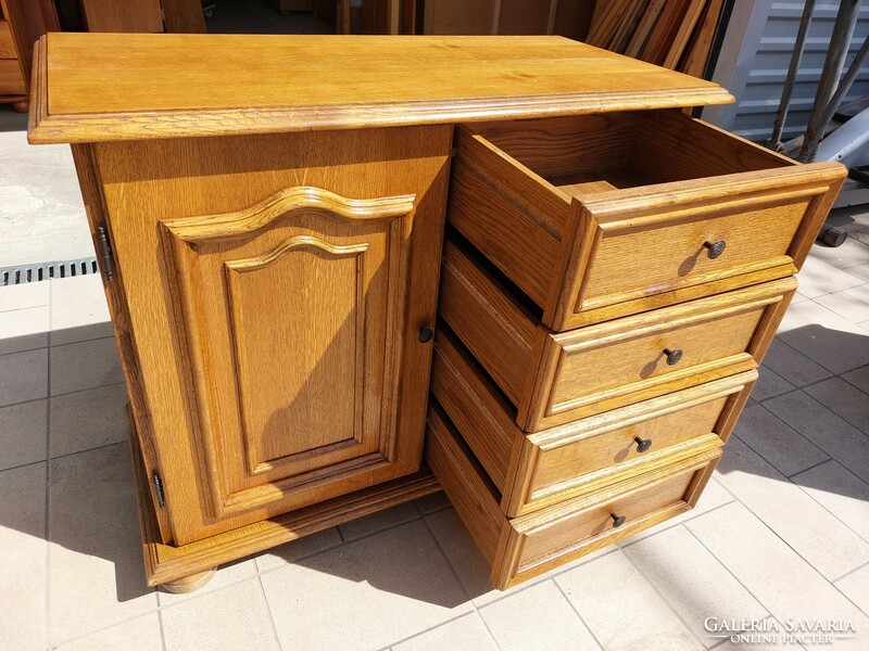 A 4-drawer oak chest of drawers with doors for sale. Furniture is beautiful, in like-new condition.