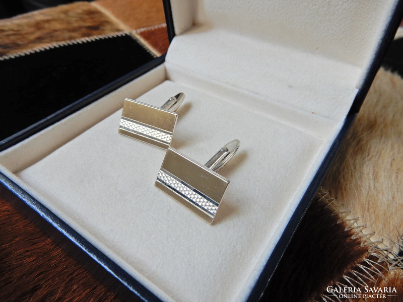 Pair of old silver cufflinks with gilded and engraved surfaces