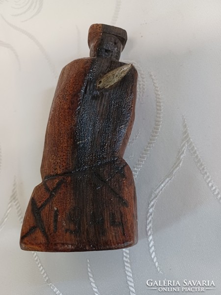 World War Ii wood carving with cartridge
